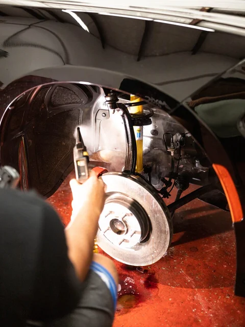 Wheel off, a light held over the bare brake rotor