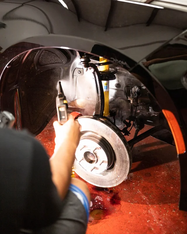 Wheel off, a light held over the bare brake rotor